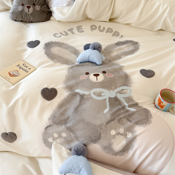 Children's bedding set with large rabbit motif, plush appliqué and pom-pom corners