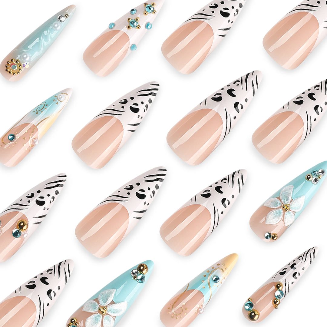 Artistic stiletto nails with floral accents and glitter details Stornfield