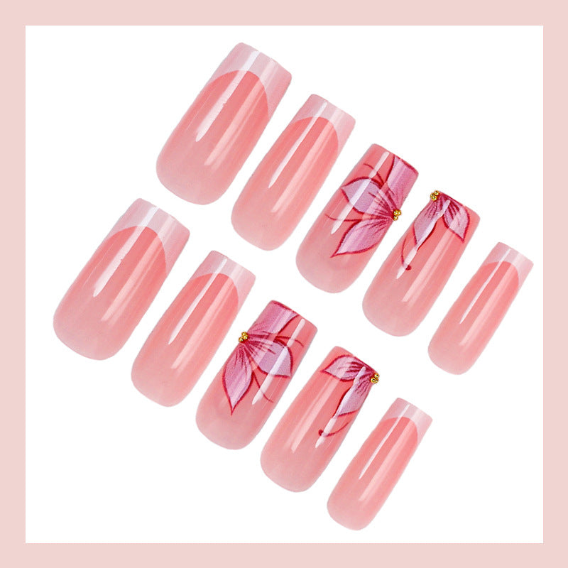 Artificial nail set with elegant flower designs and glitter accents Stornfield