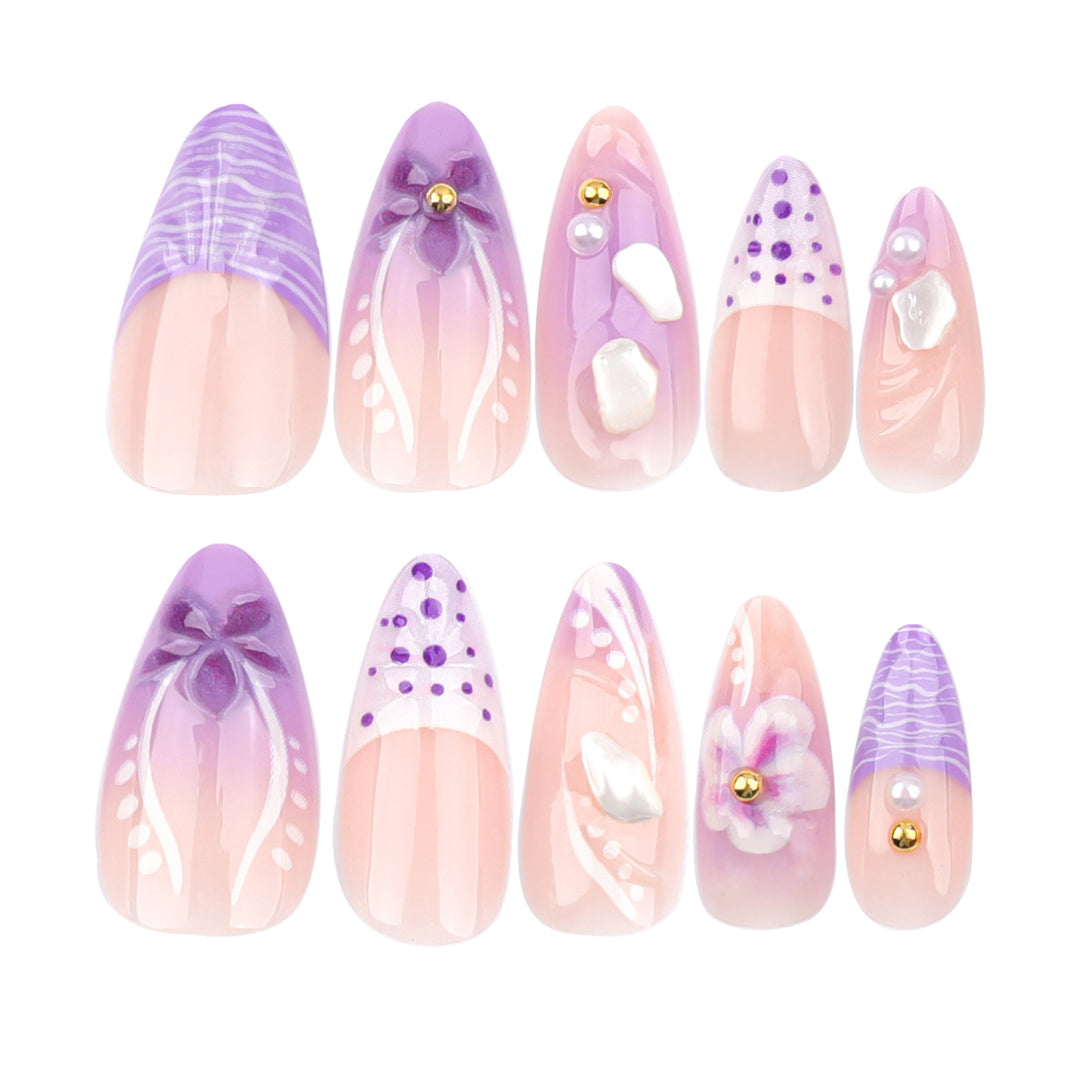 Artful nail extensions with elegant floral embellishments Stornfield