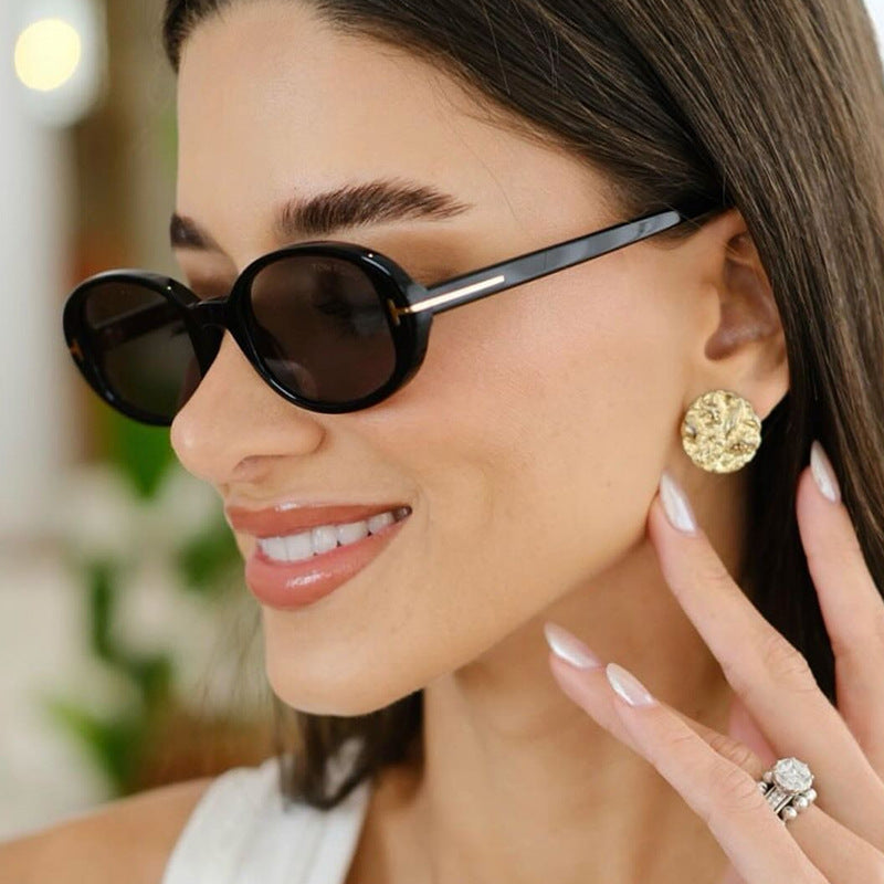 Ladies stylish oval sunglasses with golden details Stornfield