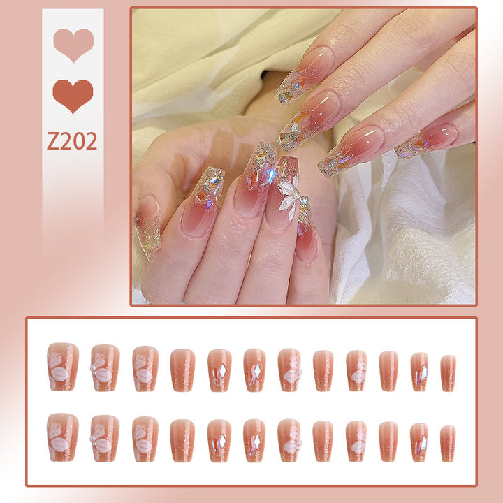 Artificial nail set with floral and glittering accents Stornfield