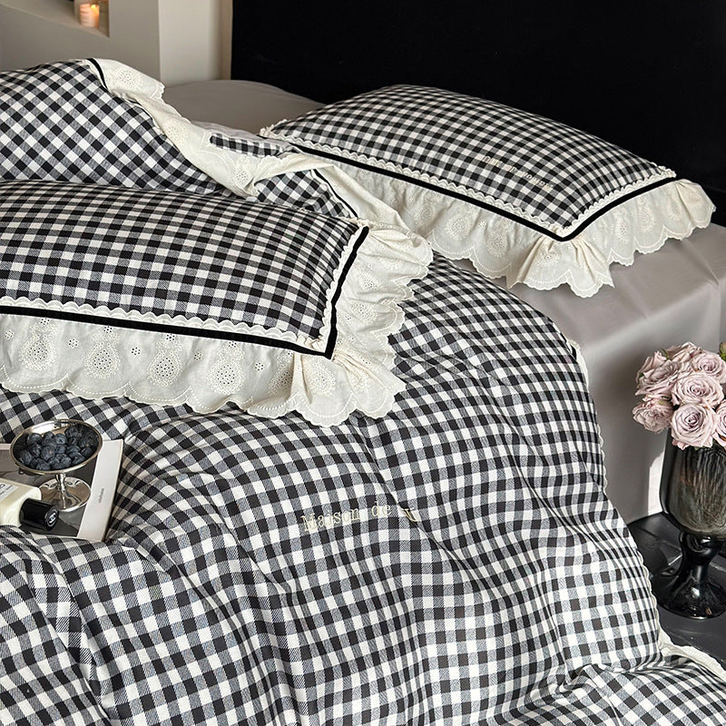 Quilted bedding set made of cotton blend with check pattern and decorative lace ruffle
