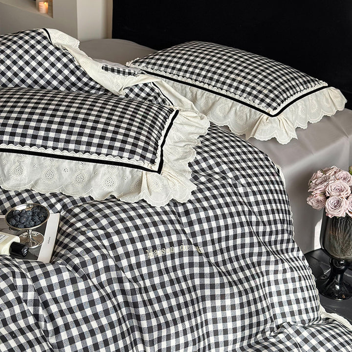Quilted bedding set made of cotton blend with check pattern and decorative lace ruffle