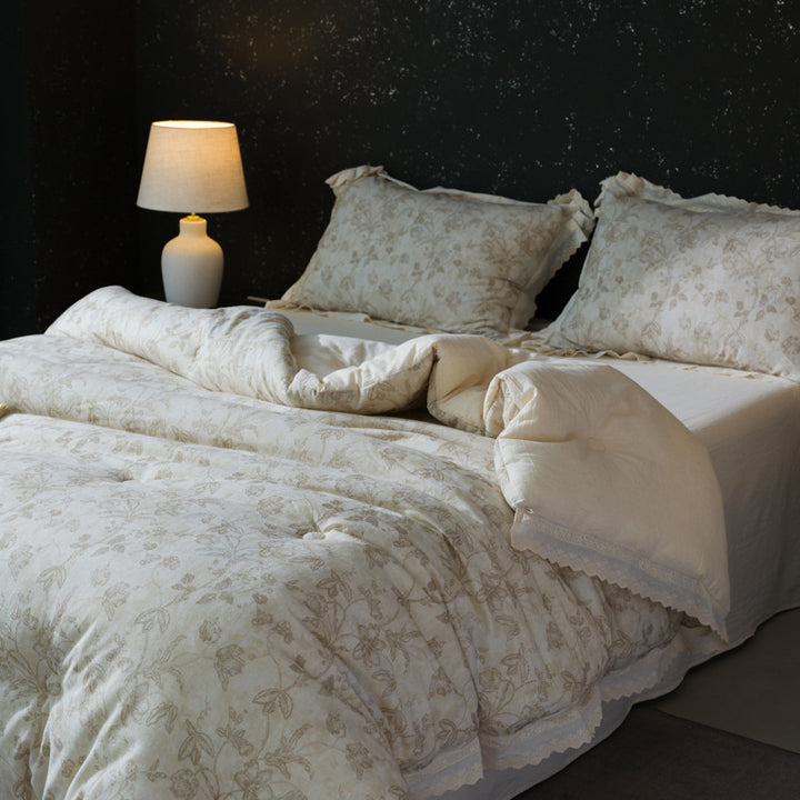 Bedding set made of cotton blend with subtle floral stitching pattern and lace border