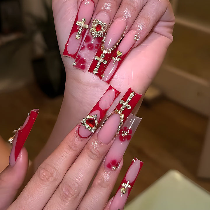 Glamorous Stiletto Press-On Nails with Artistic Gold and Red Accents Stornfield