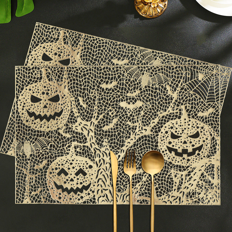 Halloween plastic table mats with intricate pumpkin and spider web design