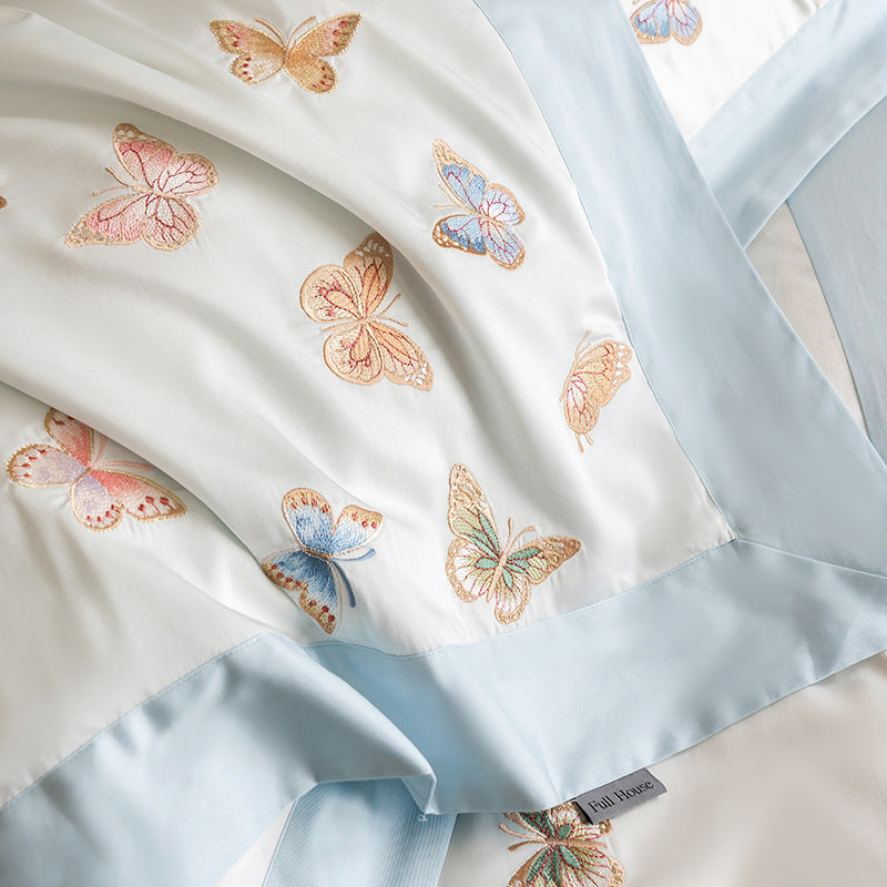 Luxurious cotton satin bedding set with embroidered butterfly appliqués
