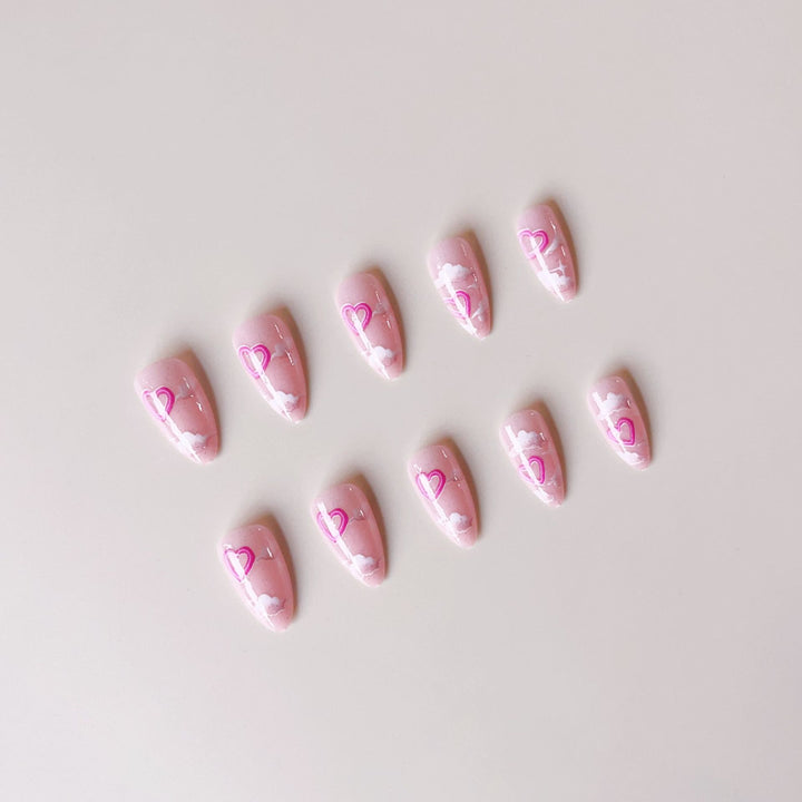 Artificial nail set with romantic heart accents and sparkling finish Stornfield