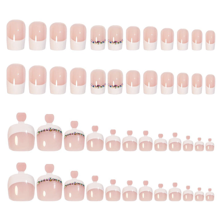 Acrylic nail set with elegant French design and rhinestone embellishments Stornfield