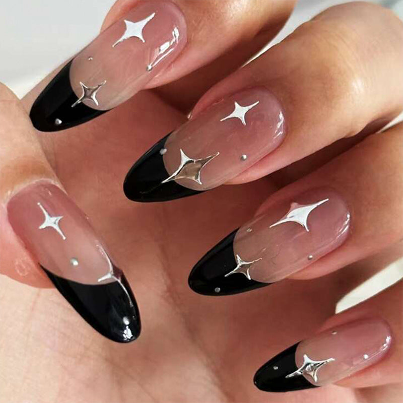 Artful stiletto nails with heart-shaped accents Stornfield