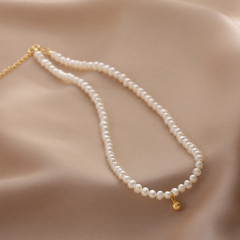 Delicate pearl necklace with elegant gold accent chain Stornfield