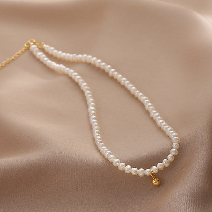 Delicate pearl necklace with elegant gold accent chain Stornfield