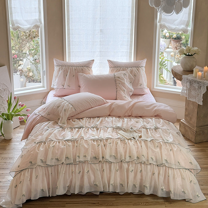 Vintage-inspired ruffle bed set with fine floral embroidery and ruched coverlet