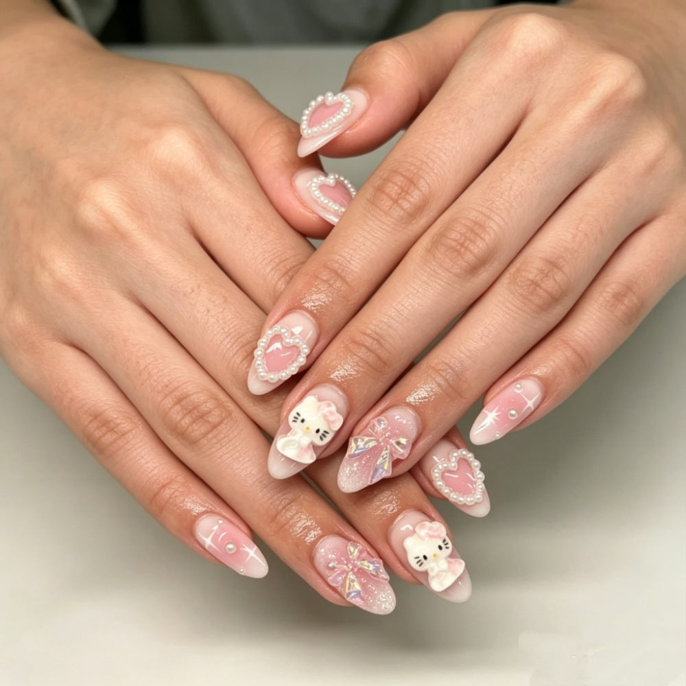 Playful artificial nails with heart and kitty motifs Stornfield