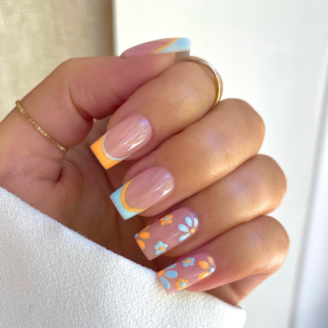 Nail art set with creative floral designs and elegant French finish Stornfield