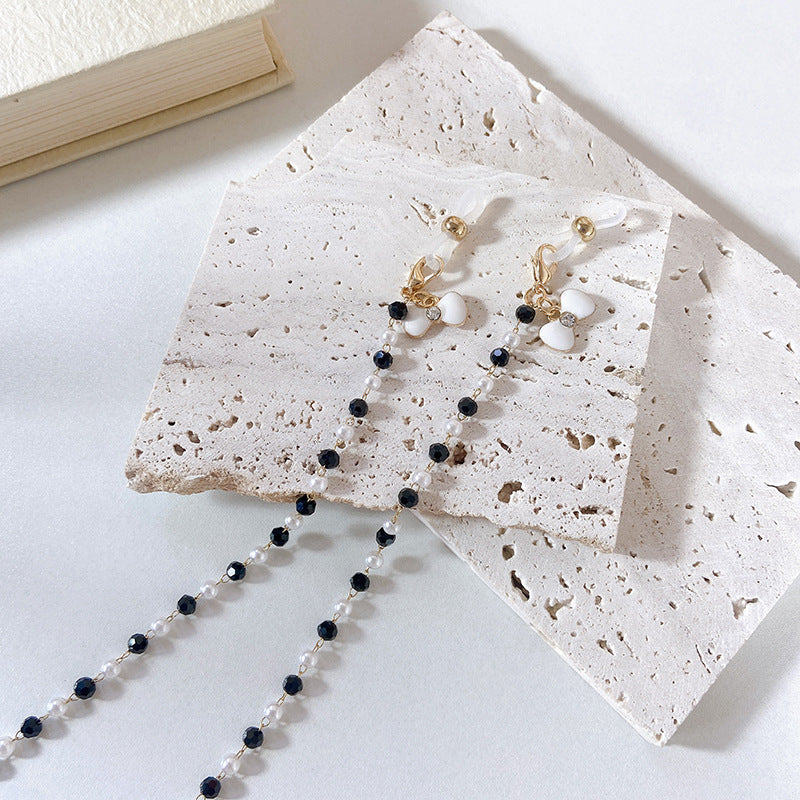 Elegant earrings with pearls and flower pendants Stornfield
