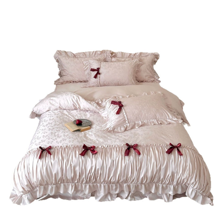 Luxurious satin bedding set with ruffles and decorative bows