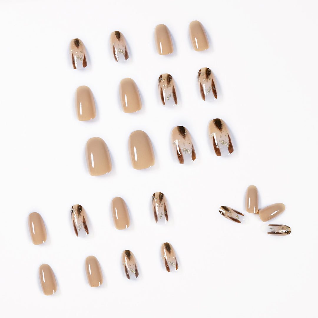 Artificial nail extensions with modern design and glitter accents Stornfield