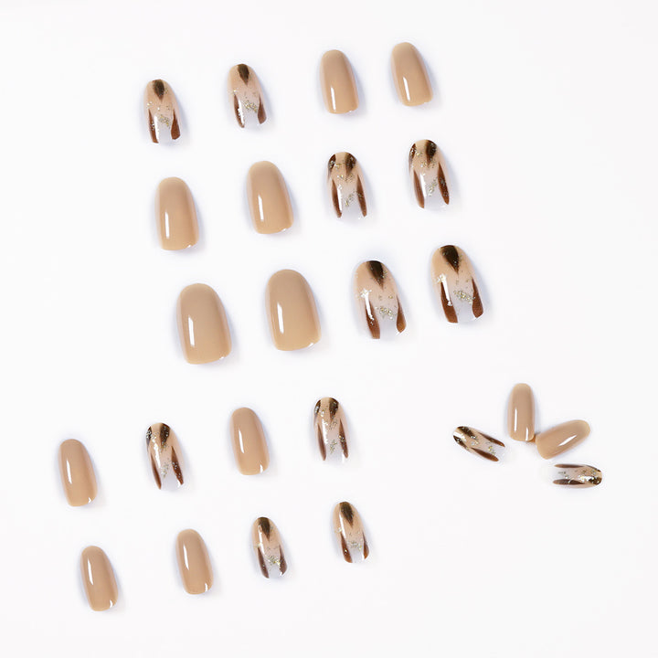 Artificial nail extensions with modern design and glitter accents Stornfield