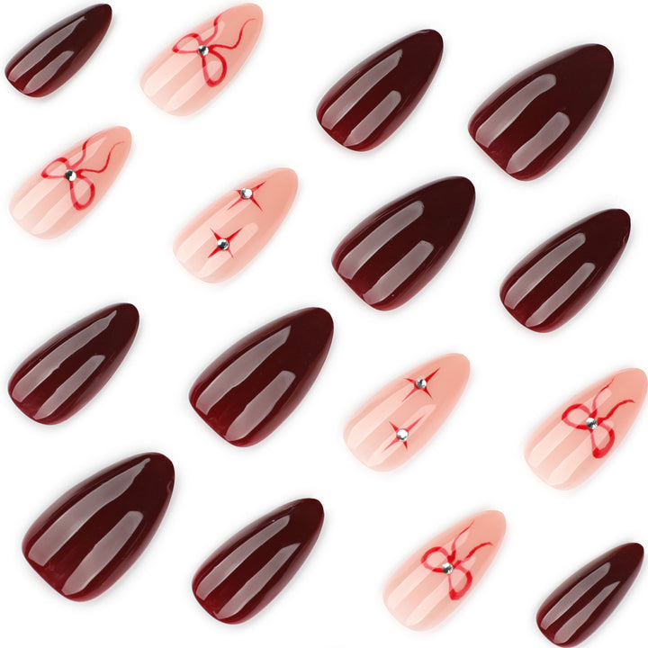 Artful nail art with elegant bows and rhinestone embellishments Stornfield