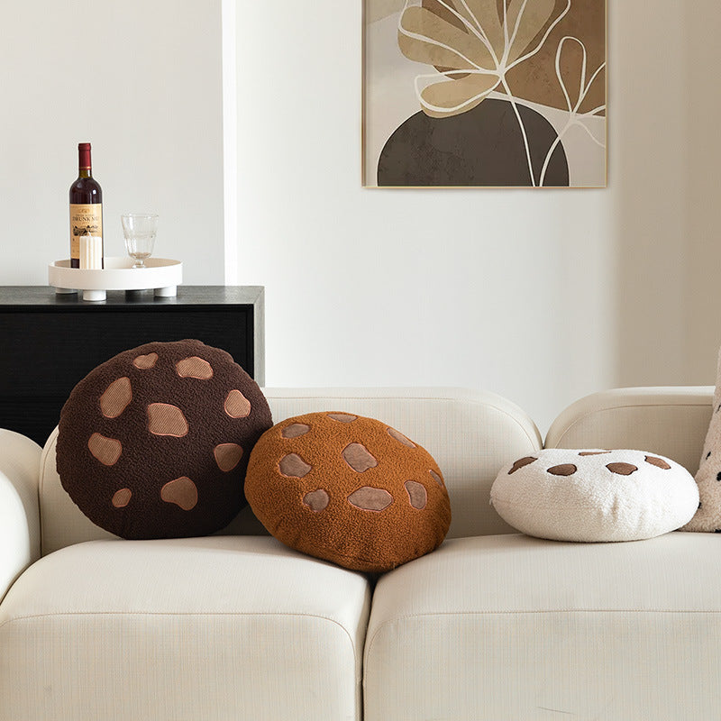 Round cuddle seat cushion with teddy fleece and abstract patch appliqués Stornfield
