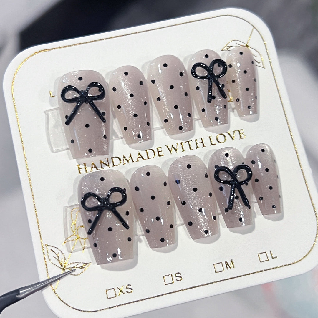 Artful Nail Extensions with Bow Pattern Stornfield