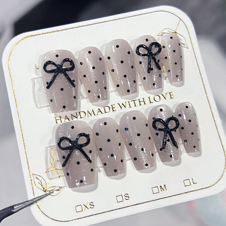 Artful Nail Extensions with Bow Pattern Stornfield