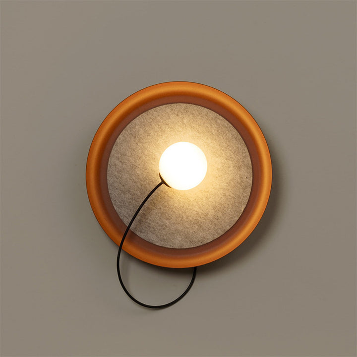 Modern Wall Sconce with Fabric Backdrop and Soft Glow
