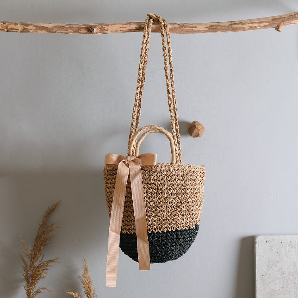Basket bag with stylish carrying handles and decorative bow Stornfield
