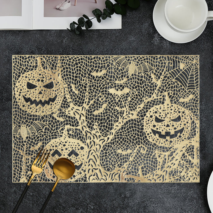 Halloween plastic table mats with intricate pumpkin and spider web design