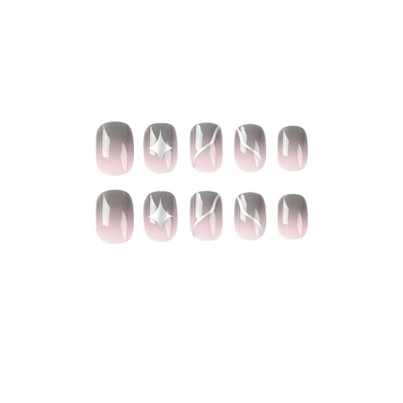 Artificial nail art with elegant ombre design and charming accents Stornfield