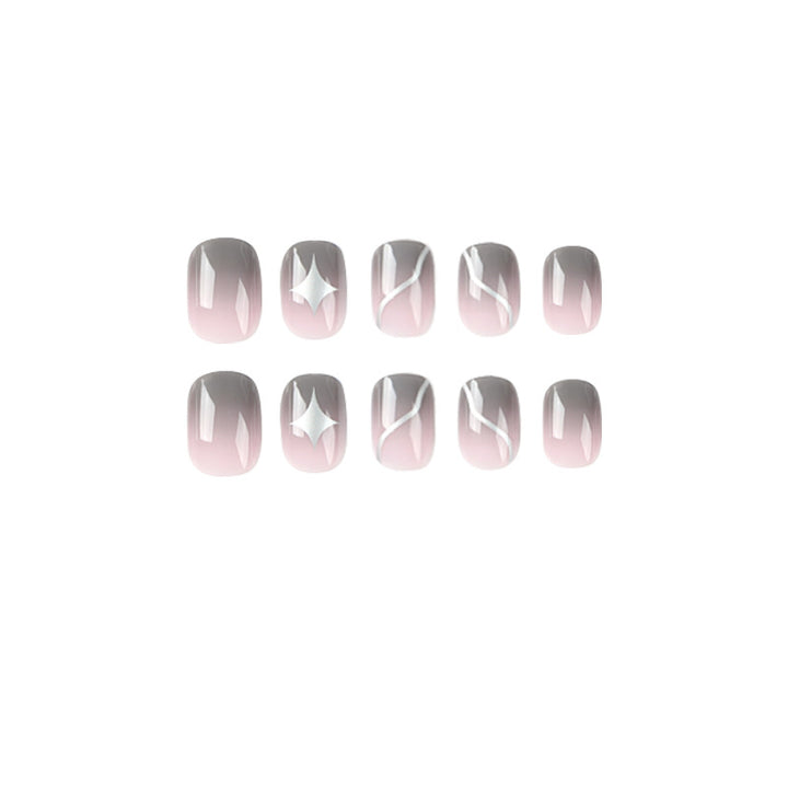 Artificial nail art with elegant ombre design and charming accents Stornfield