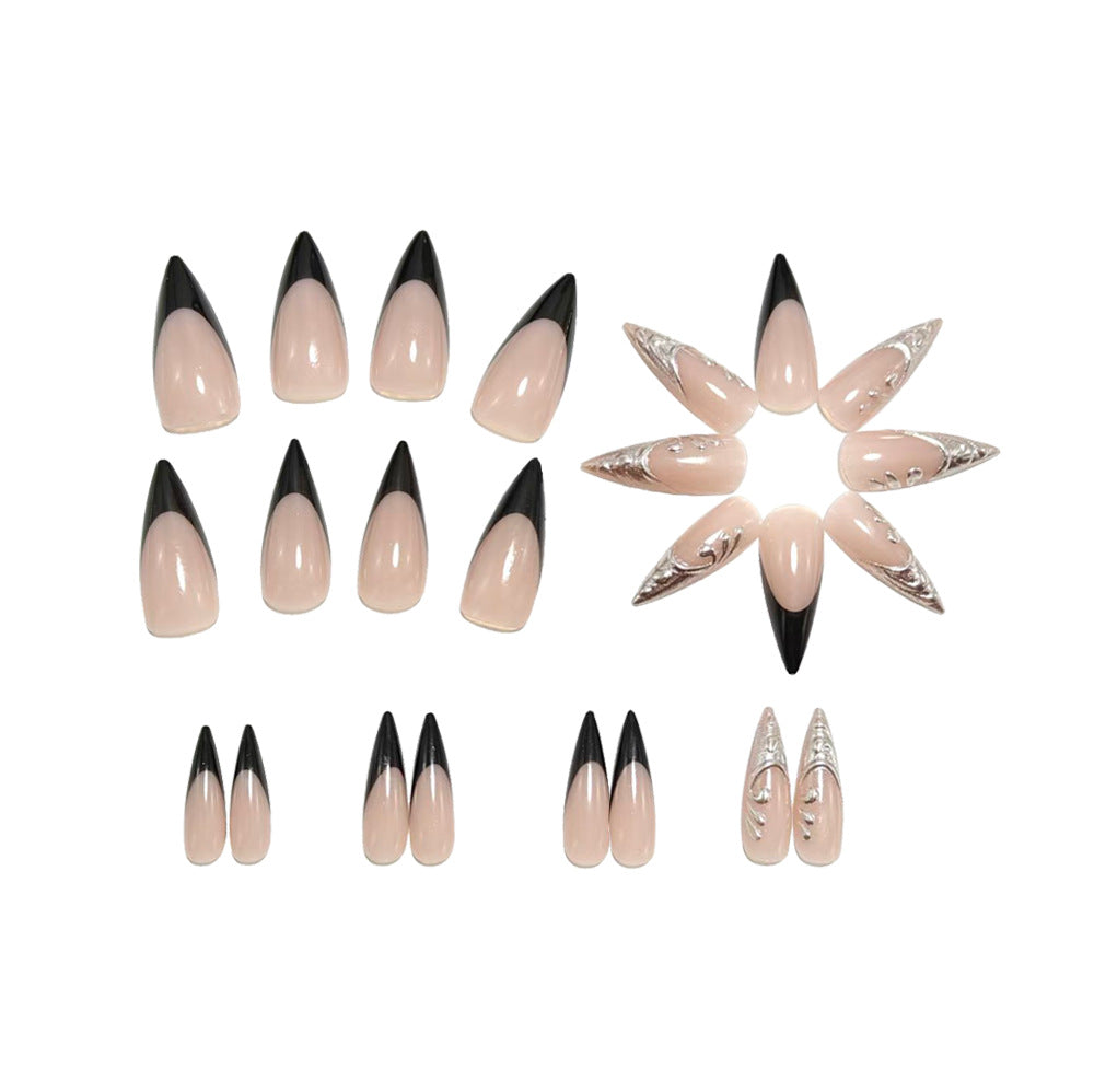 Artificial nails in elegant stiletto style with elaborate metal decoration Stornfield