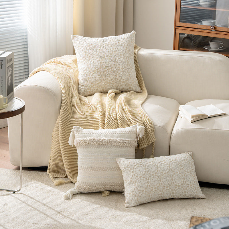 Square decorative cushion with crocheted ornament overlay and linen texture