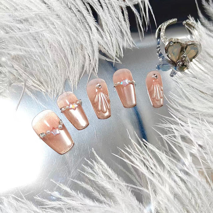 Exquisite artificial nails with glitter and pearl accents Stornfield