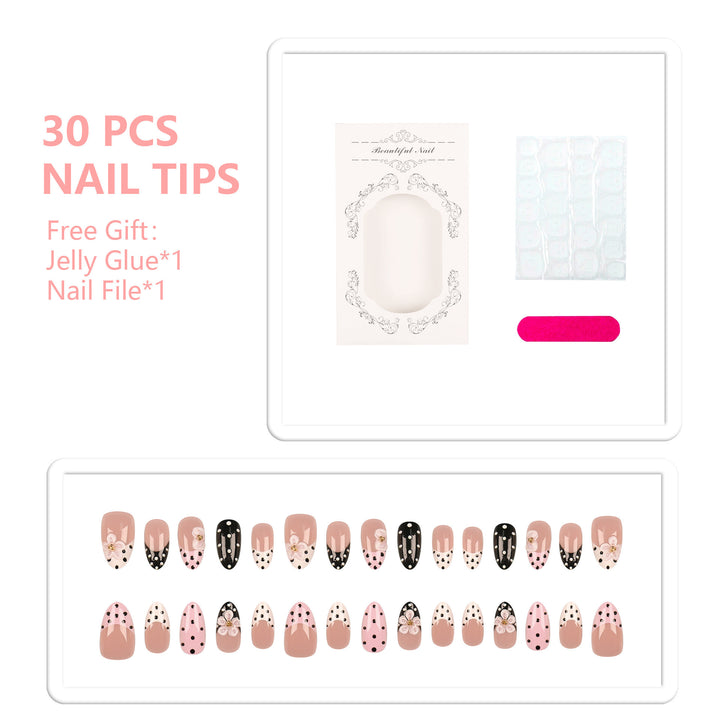 Artistic Press-On Nail Set Featuring Floral and Polka Dot Designs