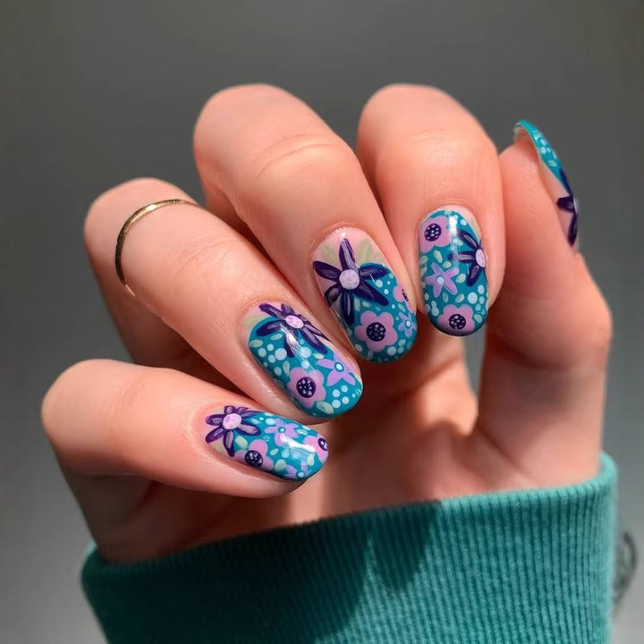 Nail art set with floral accents and vibrant patterns Stornfield