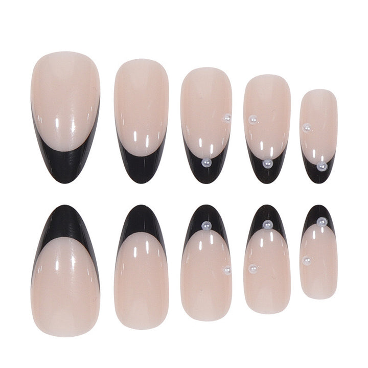 Artificial nail set with glossy French design and delicate 3D accents Stornfield