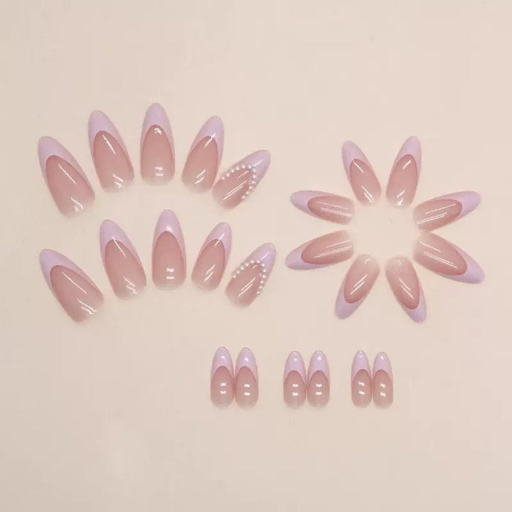 Elegant artificial nail tips with glitter and pearl decorations Stornfield