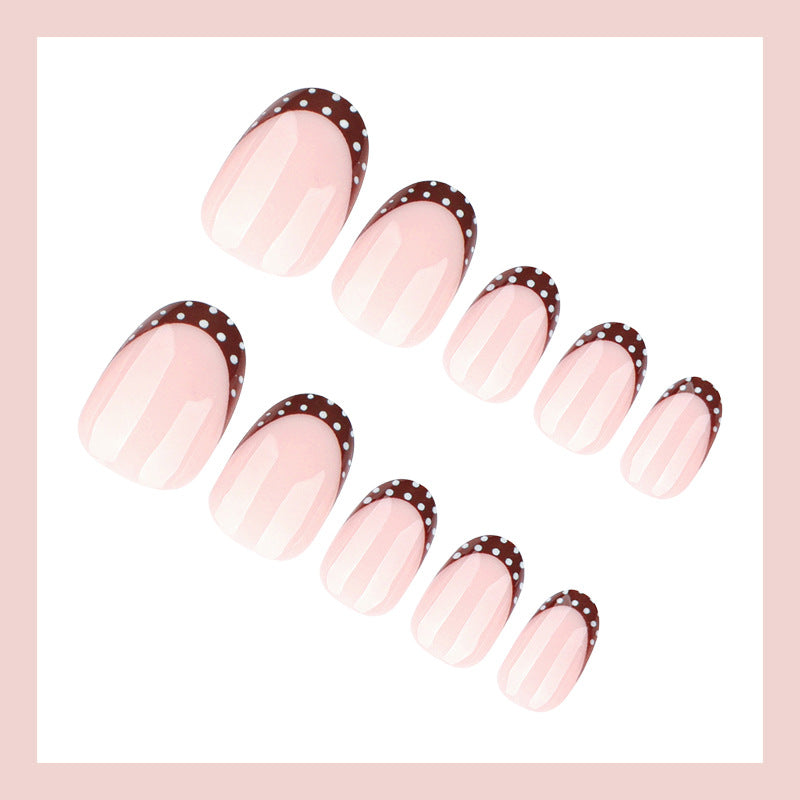 Artificial nail set with elegant French tips and subtle dots Stornfield