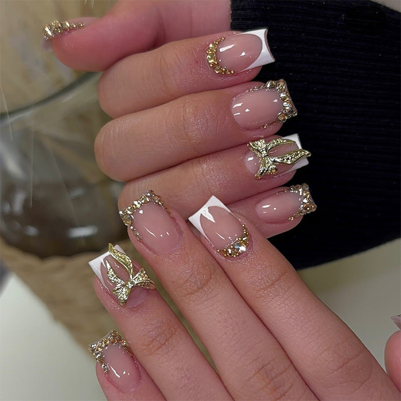 Artificial nail set with elegant glitter and flower decorations Stornfield