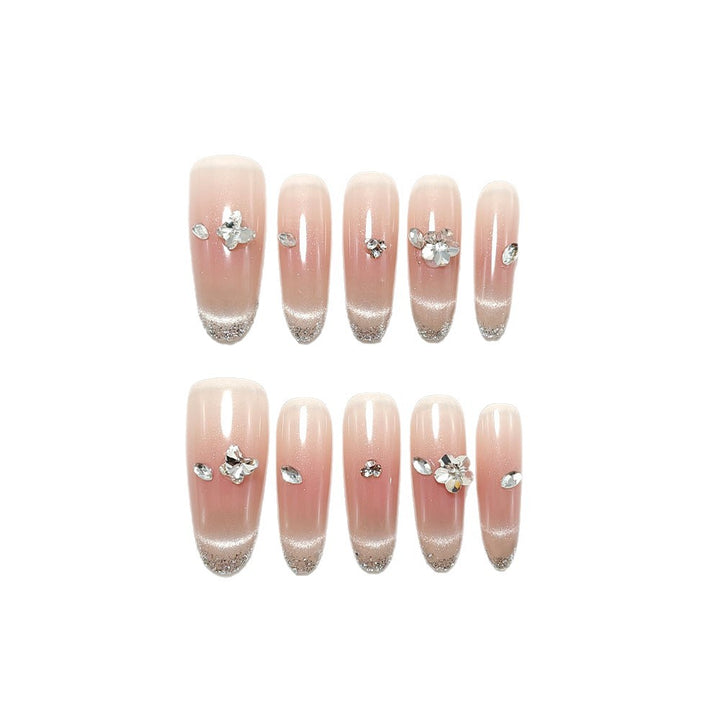 Glamorous artificial nails with rhinestone decorations Stornfield