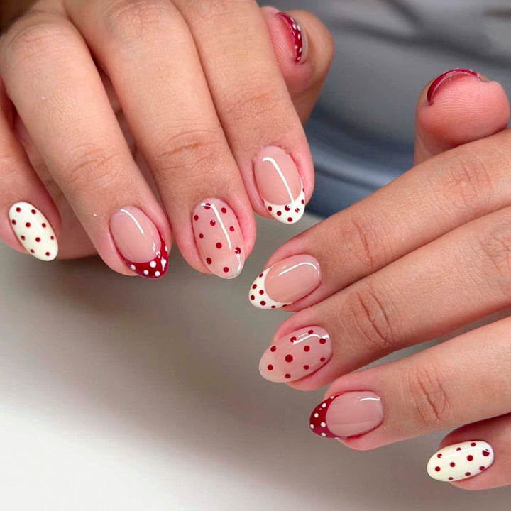 Artificial nail art with playful dots and bows Stornfield