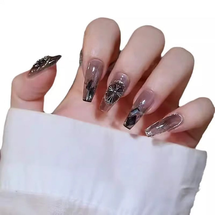 Glamorous artificial nails with heart design and glittering accents Stornfield
