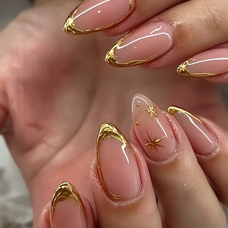 Art nail set with elegant gold accents and romantic star pattern Stornfield