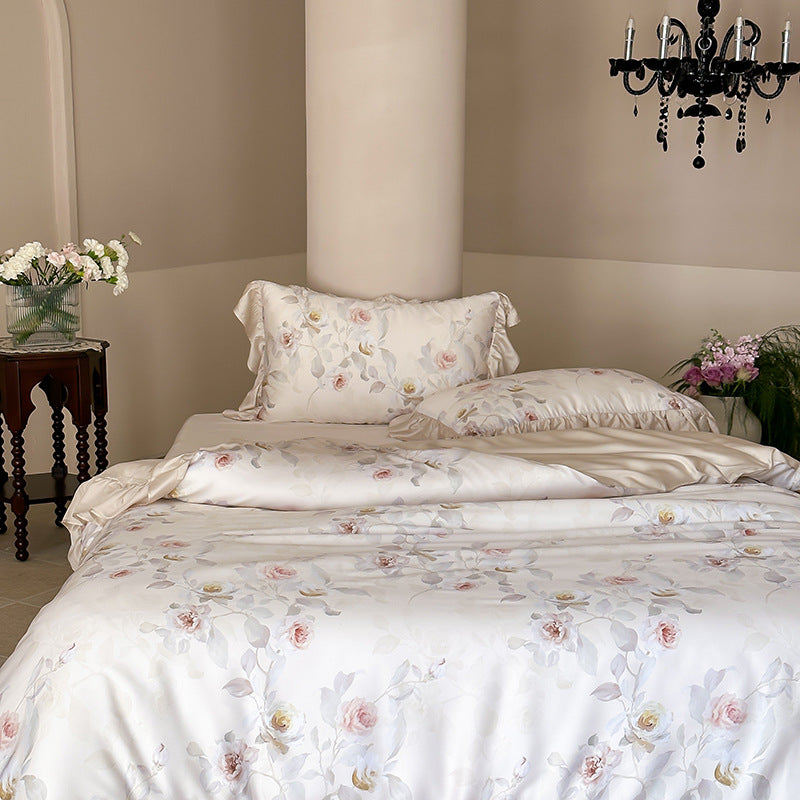 Luxurious satin bedding set with ruffled pillows and delicate watercolor rose print