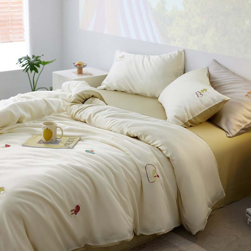 Reversible bedding set made of cotton percale with finely embroidered breakfast motifs