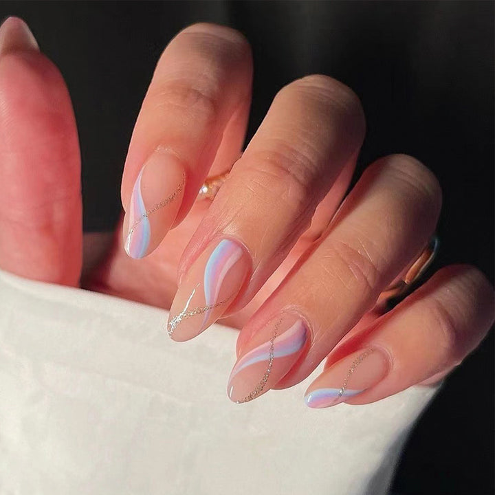 Artful nail extensions with an elegant leaf pattern Stornfield