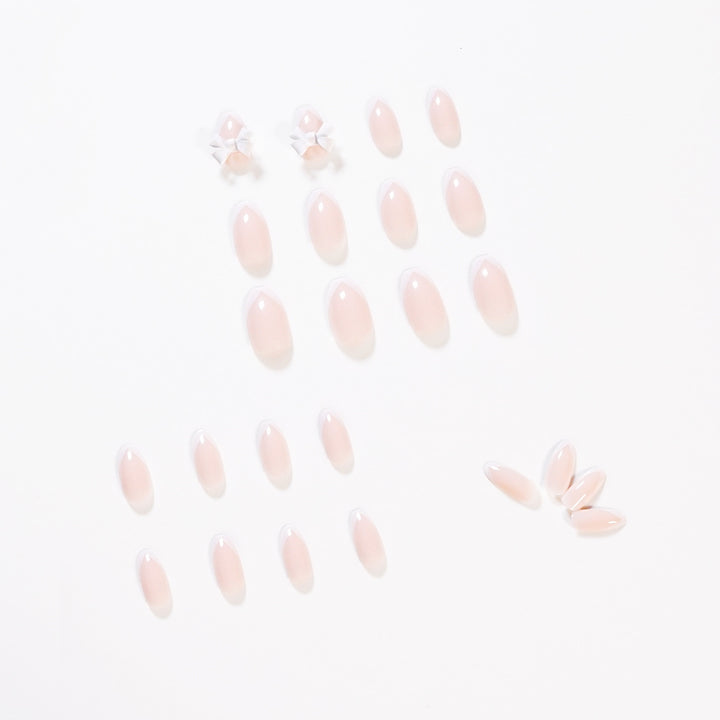 Elegant artificial nails with translucent French tip and decorative floral accents Stornfield